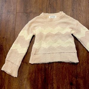 Really cute light pink and cream/white women’s sweater!